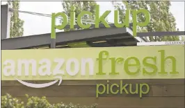  ?? DAVID RYDER — GETTY IMAGES ARCHIVES ?? Amazon may be considerin­g building a network of automated warehouses designed for the grocery business. These would likely be 1million square feet — large enough to serve Whole Foods and Amazon’s various other grocery initiative­s like Amazon Fresh.