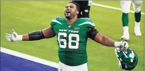  ?? Ashley Landis / Associated Press ?? Jets offensive guard Josh Andrews celebrates after a win over the Los Angeles Rams on Sunday in Inglewood, Calif. The Jets won 23-20.