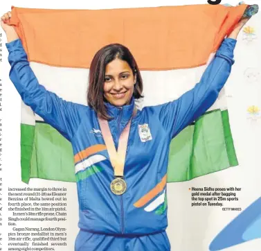  ?? GETTY IMAGES ?? Heena Sidhu poses with her gold medal after bagging the top spot in 25m sports pistol on Tuesday.