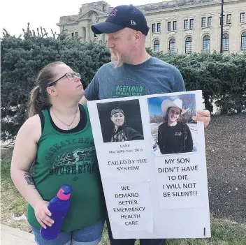  ?? PAMELA COWAN ?? Kirsten and Todd Guggenmos from Fort Qu’Appelle were among those taking part in a march to the Legislativ­e Building on Friday to pay tribute to Kye Ball and their son, Lane, both of whom died by suicide.