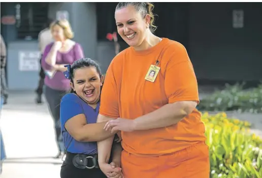  ?? PHOTOS BY DAVID WALLACE/THE REPUBLIC ?? Angelina clings to mom Shantel Rocha during a visit to the prison complex. Each Scout meeting gave the family two hours together. “My goal is to make sure that Angelina knows, without an ounce of doubt in her body, that I am always there for her,”...