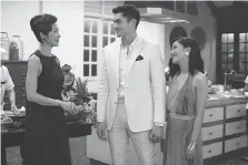  ?? SANJA BUCKO/WARNER BROS. ?? Michelle Yeoh, left, Henry Golding and Constance Wu in Crazy Rich Asians, a reworked version of the rom-com genre, which has come in and out of fashion over the years.