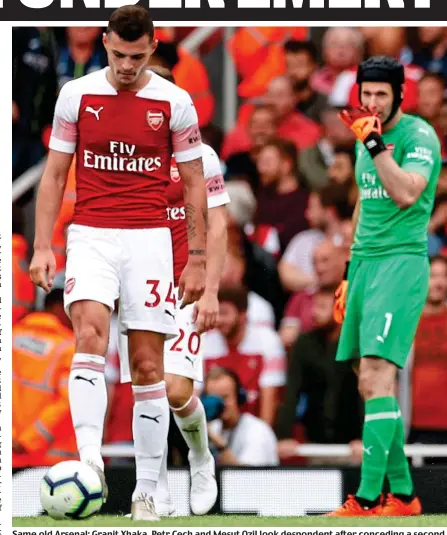  ??  ?? Same old Arsenal: Granit Xhaka, Petr Cech and Mesut Ozil look despondent after conceding a second goal to Manchester City