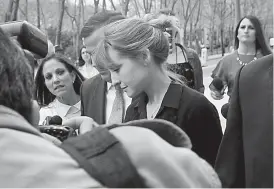  ?? AP Photo/Bebeto Matthews ?? ■ Actress Allison Mack, center, leaves after a hearing at Brooklyn Federal Court on Friday in New York. The former “Smallville” actress and Keith Raniere, the leader of the self-help group NXIVM, are charged with coercing women who joined the...