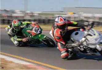  ??  ?? 01 01 Trevor Westman in his element chasing and passing another competitor. 02 Pit boards used to indicate the lap times of each rider. 03 For safety reasons, bikes are not allowed to be ridden in the pit lane, only pushed.