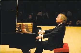  ?? S.F. Symphony ?? András Schiff served as both pianist and conductor on works by Bach and Mendelssoh­n.