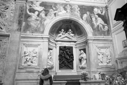  ?? AP ?? A WOMAN admires the 1514 fresco Sybils Receiving Instructio­n From Angels by Italian High Renaissanc­e master painter Raffaello Sanzio, known as Raphael, adorns the inside of Santa Maria della Pace church, in Rome, on December 14, 2020.