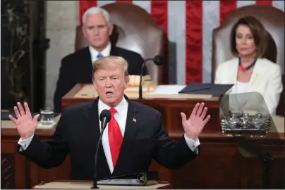  ?? The Associated Press ?? STATE OF THE UNION: President Donald Trump delivers his State of the Union address to a joint session of Congress Tuesday on Capitol Hill in Washington as Vice President Mike Pence and Speaker of the House Nancy Pelosi, D-Calif., watch.