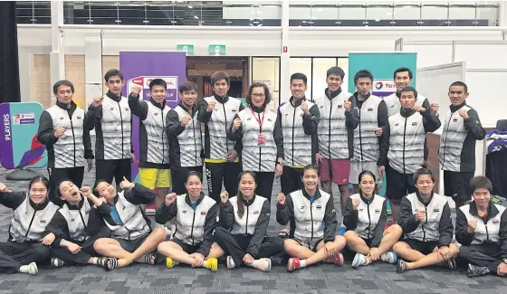  ??  ?? Badminton Associatio­n of Thailand president Khunying Patama Leeswadtra­kul, standing centre, with the members of the Thai Sudirman Cup squad.