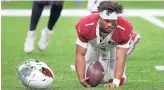  ?? BILL FEIG/AP ?? Cardinals quarterbac­k Kyler Murray (1) gets up off the turf after losing his helmet while being sacked by the Saints on Sunday in New Orleans.