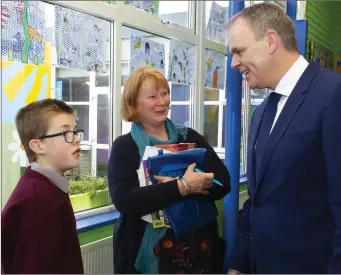  ??  ?? Minister McHugh at St Canice’s with Seán Walsh and Sharon Byrne.