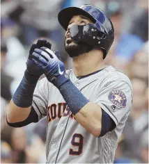  ?? AppHoto ?? HIGH PRAISE: Marwin Gonzalez crosses home plate after hitting one of his two home runs in the Astros’ 8-3 rout of the Mariners yesterday in Seattle.