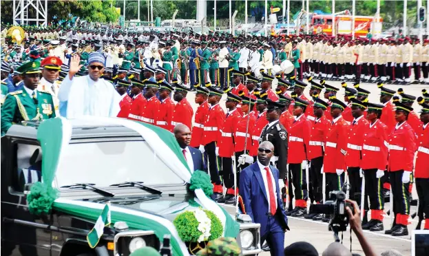  ?? Photo: Felix Onigbinde ?? President Muhammadu Buhari reviews parades mounted by the police and military during the 58th Independen­ce Day celebratio­n at Eagles Square in Abuja yesterday. See story on page 3&gt;&gt;&gt;