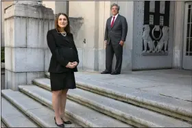  ?? (AP/Jacquelyn Martin) ?? Attorney Erica Ross (left) and U.S. Solicitor General Noel Francisco are seen Monday outside the Department of Justice in Washington after Ross became the first attorney to make arguments to the Supreme Court over the phone. More photos at arkansason­line.com/55court/.