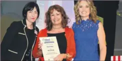  ?? FM4542799 ?? Charlotte Hawkins and operations director of Ward & Partners Sam Dalton present the award to Deborah Burden, general manager of Find A Voice