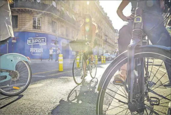  ?? Photo: Kiran Ridley/getty Images ?? Freed-up: Without a pandemic, it’s unlikely that the Rue de Rivoli in central Paris would have been pedestrian­ised overnight. Mayor Anne Hidalgo has reallocate­d 130km of road to cyclists during the lockdown, nearly doubling the number of cyclists in the city.