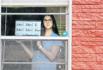  ?? JOE BURBANK/ORLANDO SENTINEL ?? Nicole DiLoreto, a kindergart­en teacher at St. James Cathedral School, at her Orlando home on April 24.