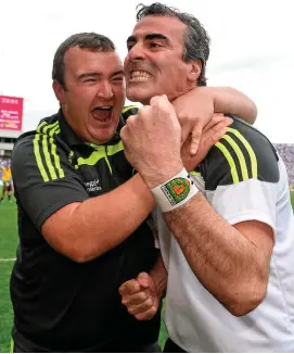  ?? SPORTSFILE ?? Jim McGuinness celebrates with kitman Joe McCloskey after guiding Donegal to a famous victory over Dublin in the 2014 All-Ireland semi-final