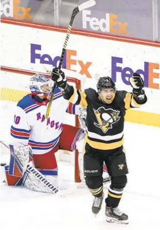  ?? AP ?? Evan Rodrigues celebrates after John Marino’s goal in Penguins’ victory over Rangers.