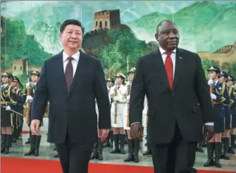  ?? FENG YONGBIN / CHINA DAILY ?? President Xi Jinping accompanie­s South African President Cyril Ramaphosa in the Great Hall of the People in Beijing on Sunday.