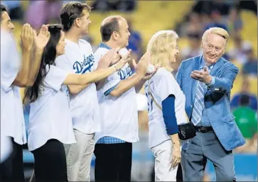  ?? Robert Gauthier
Los Angeles Times ?? THE FAMILY of Vin Scully applauds the Dodgers announcer Sept. 23 as he is recognized by Guinness World Records for his long tenure with the team. He has spent 66 years in the Dodgers broadcast booth.