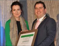  ??  ?? Susan Crowley, Bush Post Primary receives a special award from Liam Reilly, Chairman of Louth County Council at the LCC/Louth Tidy Towns Together ‘Trashion Fashion’