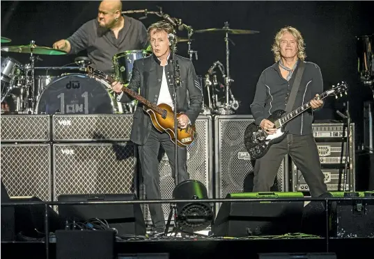  ?? JASON DORDAY/STUFF ?? Paul McCartney walked out on stage at his ‘One on One’ Tour at Mt Smart Stadium, Auckland, with no words, just a salute – then tore into the old favourites.