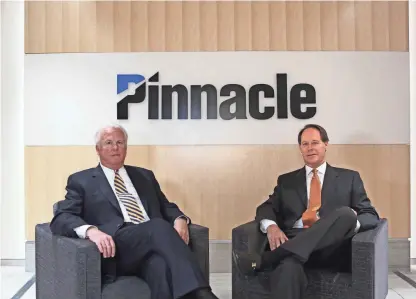  ?? YALONDA M. ?? Pinnacle Financial Partners President and CEO Terry Turner, left, and Kirk Bailey, chairman of the Memphis branch, sit in their new office building at 949 South Shady Grove Road in the Ridgeway Center. Three years after Nashville-based Pinnacle...