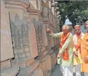  ?? HT PHOTO ?? VHP’s new chief Vishnu Sadashiv Kokje observing the stone pillars for the proposed Ram Mandir at VHP’s workshop in Ayodhya on Monday.