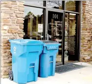  ?? Keith Bryant/The Weekly Vista ?? The 95- and 65-gallon trash bins Republic will be providing to Bella Vista residents displayed in front of the main entrance to City Hall.