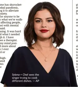  ?? — AP ?? Selena + Chef sees the singer trying to cook different dishes.