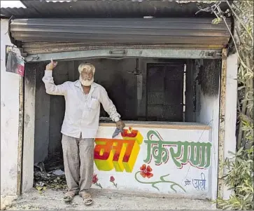  ?? Kashif Kakvi Associated Press ?? NAWAB KHAN stands at his shop that was vandalized by a mob in Khargone, India. On April 10, a festival marking the birth anniversar­y of Lord Ram turned violent as Hindu mobs called for violence against Muslims.