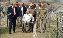  ?? ERIC GAY — THE ASSOCIATED PRESS ?? Republican presidenti­al candidate former President Donald Trump talks with Texas
Gov. Greg Abbott during a visit to the U.S.-Mexico border Thursday in Eagle Pass, Texas.