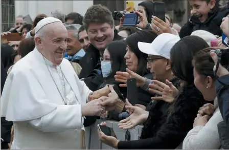  ?? ASSOCIATED PRESS ?? Pope Francis salutes the faithful in St. Peter’s Square at the Vatican before leaving after his weekly general audience Feb. 26.