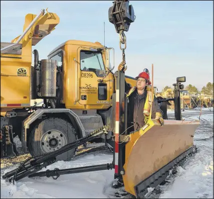  ?? HARRY SULLIVAN/TRURO DAILY NEWS ?? Department of Transporta­tion and Infrastruc­ture Renewal shop mechanic Richard Manthorne and other crew members were installing a wing plow on a brand new twin steer Mack truck in preparatio­n for Thursday’s forecast storm. The plow truck, which is...