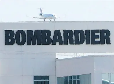  ?? RYAN REMIORZ / THE CANADIAN PRES FILES ?? A plane comes in for a landing at a Bombardier plant in Montreal. Bombardier shares have fallen more than 60 per cent since July on investor unease about its hefty debt and ability to generate promised free cash flow.