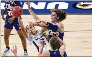  ?? ERIC GAY / AP ?? South Carolina forward Victaria Saxton (left) and Georgia Tech forward Lorela Cubaj (back right) battle for a rebound Sunday in a Sweet Sixteen at the Alamodome in San Antonio. The Gamecocks won 76-65.