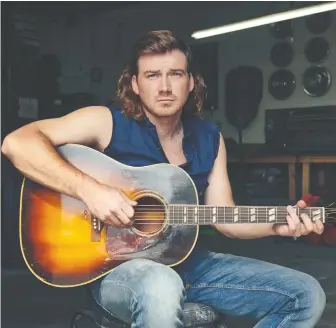  ?? JOHN SHEARER ?? Country musician Morgan Wallen got himself in hot water by publicly violating COVID-19 protocols, which resulted in his October appearance on Saturday Night Live being cancelled. The singer was given a second chance by the show, and subsequent­ly appeared in December — even performing in a sketch about his mistake.