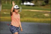  ?? REBECCA BLACKWELL/AP ?? Nasa Hataoka, waving to the gallery during the LPGA Tour Championsh­ip on Sunday, earned more than $1 million from two runner-up finishes in 2021.