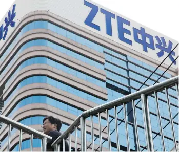  ?? NG HAN GUAN/THE ASSOCIATED PRESS ?? The U.S. ban on Chinese telecommun­ications firm ZTE for breaching terms of a settlement over sanction-breaking sales to Iran and North Korea has become entwined in the trade dispute between the U.S. and China.
U.S. President Donald Trump says too many...