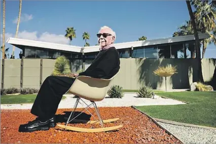  ?? James Schnepf Palm Springs Modern Living ?? ‘PROLIFIC AND INNOVATIVE’ Architect William Krisel in front of one of the tract homes he designed in Palm Springs. “Before that, affordable tract houses were tacky, low-ceiling cracker boxes with holes poked out for windows,” Krisel told The Times in a...