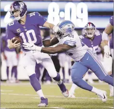  ?? JULIO CORTEZ — THE ASSOCIATED PRESS ?? Eli Manning was under pressure for much of the game Monday, and it was wrong for Giants coach Ben McAdoo to throw him under the bus.