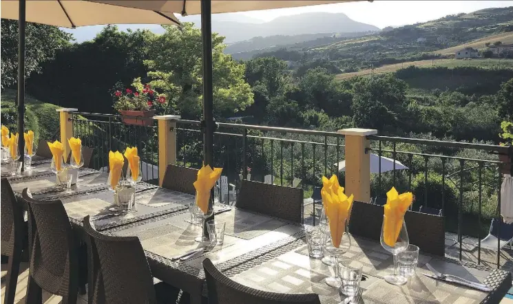 ?? PHOTOS: JEAN LEVAC ?? The back terrace at Villa d’Abruzzo has views of the pool and rolling foothills, and is the perfect setting for a meal.
