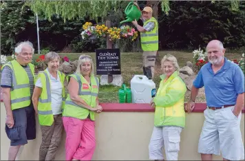  ??  ?? Nils Lignell, Jenny Balfe, Anne Hogan, Veronica Doyle, Pat Sweeney and Pat Staunton of Glenealy Tidy Towns with the water tank in the car park.