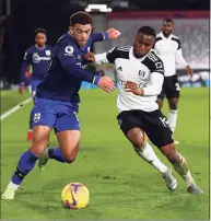  ?? Clive Rose / Associated Press ?? Fulham’s Ademola Lookman, right, duels for the ball with Southampto­n’s Che Adams.