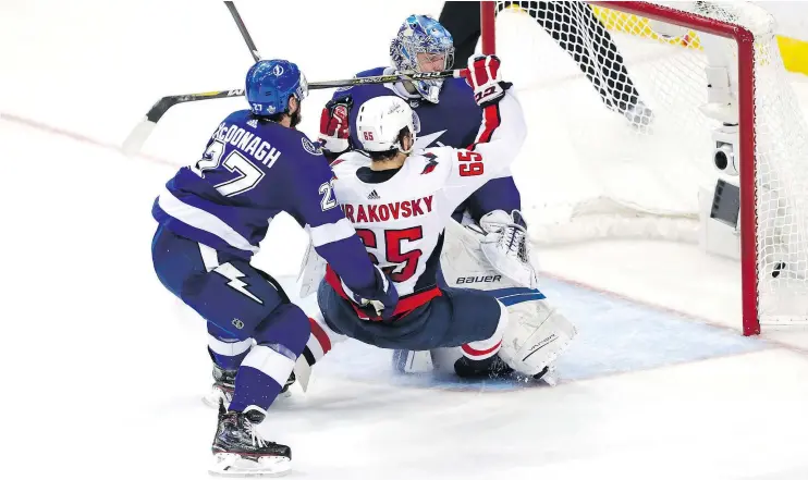  ?? — GETTY IMAGES ?? Andre Burakovsky of the Capitals scores his second goal on Andrei Vasilevski­y of the Lightning during Game 7 of the Eastern Conference Finals.