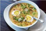  ?? Cesar Hernandez / The Chronicle/ ?? Arroz caldo, a hot bowl of comfort from 7 Miles House in Brisbane