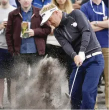  ??  ?? MELBOURNE: Denmark’s Soren Kjeldsen hit out of the rough on the fifth hole during his match at the World Cup of golf at Kingston Heath in Melbourne, Australia, yesterday. — AP