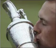  ?? DAVE THOMPSON — THE ASSOCIATED PRESS ?? Jordan Spieth of the United States kisses the trophy after winning the British Open Golf Championsh­ips at Royal Birkdale, Southport, England, Sunday.