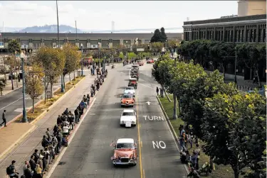  ?? Photos by Mason Trinca / Special to The Chronicle ?? Members of the Studebaker Drivers Club and the San Francisco Model A Ford Club on the parade route.